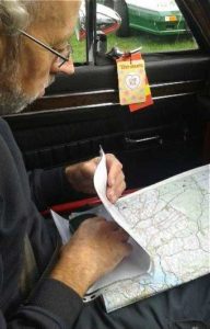 Photo of Navigator reading map