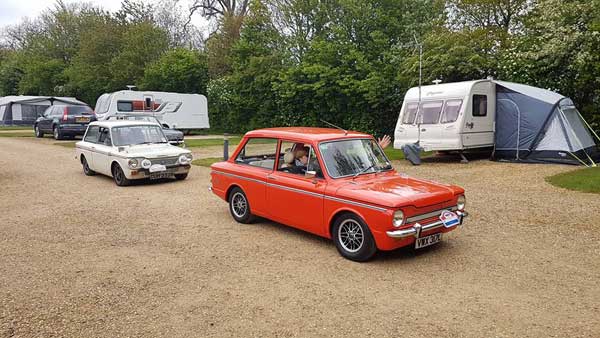 2 Imps driving away from campsite